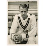 Ian Peebles, Middlesex. Good mono press photograph of a moody looking Peebles sat on a bench wearing