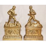 A pair of unusual Victorian brass sporting fire dogs/andiron figures. One depicts a footballer