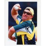 Shane Warne. Two colour press photographs, each signed to the photograph by Warne. Images depict a