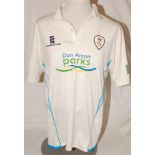 Derbyshire C.C.C. A match worn Derbyshire 1st XI white short sleeve shirt with blue trim, County