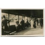 ‘Wimbledon 1914’. Rare original mono real photograph postcard showing spectators standing in a