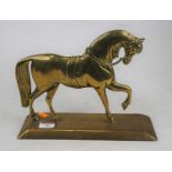 An early 20th century bronze doorstop in the form of a horse, h.21cm