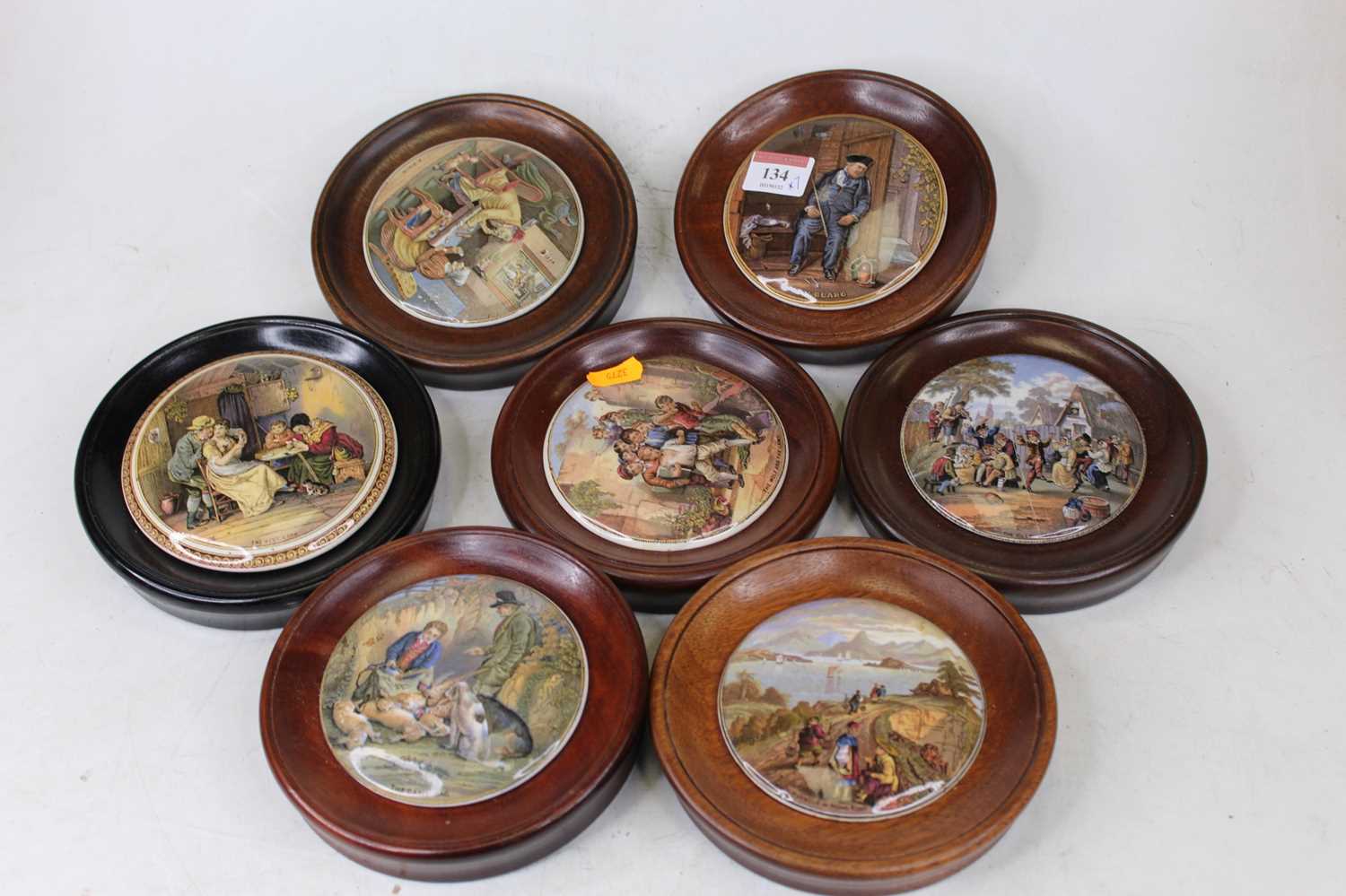 A collection of seven Victorian Prattware pot lids, to include The Wolf & The Lamb, On Guard, A