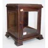 A 20th century mahogany glazed table top display cabinet, standing on four ogee bracket feet, height