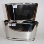 A pair of contemporary nickel plated champagne coolers, each inscribed with quotes from Napoleon