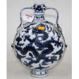 A Chinese export blue and white stoneware moonflask, the onion neck flanked by twin handles, the