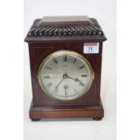 An early 20th century mahogany and boxwood strung mantel clock, the silvered dial showing Roman