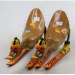 A pair of carved bamboo models of ducks on skiis, height each 24cm