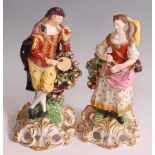 A pair of early 19th century probably Derby soft-paste porcelain figures "The Idyllic Musicians",