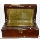 A Victorian walnut and brass inlaid writing slope, the lid lifting to reveal a fitted interior