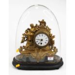 A 19th century French gilt metal mantel clock, the enamel dial showing Roman numerals, with single