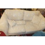 A contemporary DFS cream floral upholstered three-seater sofa, width 190cm