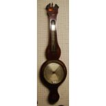 An early 19th century mahogany floral inlaid two dial wheel barometer, the silvered dial signed