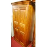 A contemporary hardwood twin recessed panelled door wardrobe, width 123cm