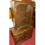 A contemporary moulded oak low double door side cupboard, with twin upper drawers; together with a