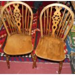 A near-set of six circa 1900 elm and fruitwood wheelback kitchen chairs (5+1)