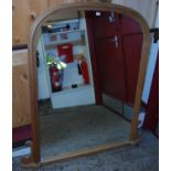 A contemporary pine arched over mantel mirror, 139 x 129cm