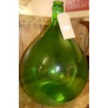 A green glass carboy, h.51cm