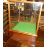 A contemporary mahogany and glass inset revolving display case, base w.65cmCondition report: