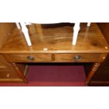 A 19th century mahogany two drawer side table, raised on turned supports, w.100cm