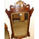 An early 20th century Chippendale style mahogany fret carved bevelled wall mirror, 90 x 52cm