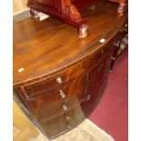 A 19th century mahogany and further strung bowfront side cupboard, having upper long frieze drawer
