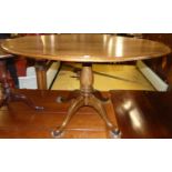 Michael Griffin - a contemporary oak oval breakfast table, raised on pedestal base, w.136cm