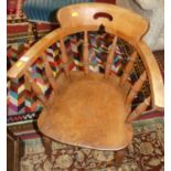 An early 20th century elm and beech captain's chair, width 61cm