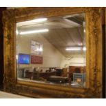 A late 19th century gilt composition framed and bevelled rectangular wall mirror, 87x102cm