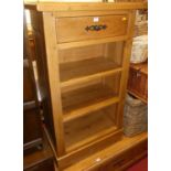 A contemporary joined light oak open bookshelf, having single upper drawer, w.66.5cm