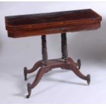 A Regency rosewood and rosewood crossbanded pedestal tea table, the fold-over top having swivel