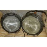 A pair of large painted industrial cast metal swing lights by The Crouse-Hinds Electrical Company,