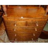 A Victorian mahogany bowfront chest, of two short over three long graduated drawers, on turned squat