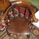 An early 20th century stained elm and beech captain's chair, width 64cm