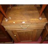 A Victorian oak single door side cupboard, having hinged upper compartment, w.66cm