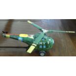 A Marx Toys Empire made tinplate and a friction drive model of a military helicopter