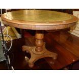 A Victorian faded mahogany and gilt tooled green leather inset circular tilt-top centre table, dia.