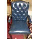 A contemporary mahogany framed and blue buttoned leather and further studded open armchair, width