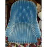 A mid-Victorian mahogany framed and blue striped button upholstered tub armchair, on turned