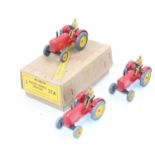 Dinky Toys No. 27A Massey Harris Tractor original trade box containing 3 examples consisting of, red