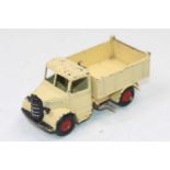 Dinky Toys No. 25M Bedford End Tipper Truck in cream with red ridged hubs in fair condition, a