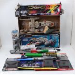 Two boxes containing a quantity of Hasbro and Bend Ems Star Wars toys to include various figures,
