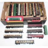 Large tray containing 19 unboxed bogie coaches, various makes & liveries; with four vehicles usually