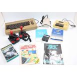 A Commodore C64 Micro Computer comprising, console, cassette player, power supply, 2x joysticks,