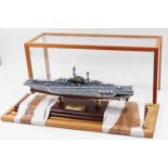 A 1:700th scale model of 'Midway' Aircraft Carrier, constructed in resin, mounted on two pillars and