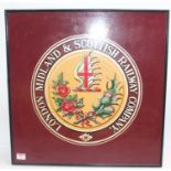 A hand-painted wooden sign depicting the LMS Insignia, 52cm x 52cm, nice example