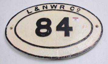 L&NWR Co. bridge plate no.84, white with black letters, mounted on wooden backing board