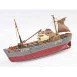 An early 1950’s scratch-built model of a Lowestoft trawler that has both sails and funnel, titled