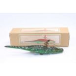 Einfalt clockwork and tinplate crocodile with opening mouth, complete with grass-skirted native
