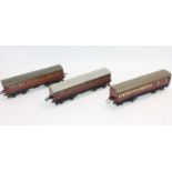 Three 1935-41 Hornby No.2 passenger coaches red LMS – 2 x 1st/3rd & one br/comp. The two 1st/3rd